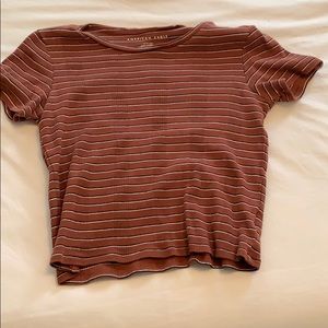 Shirt with burnt orange black and white stripes